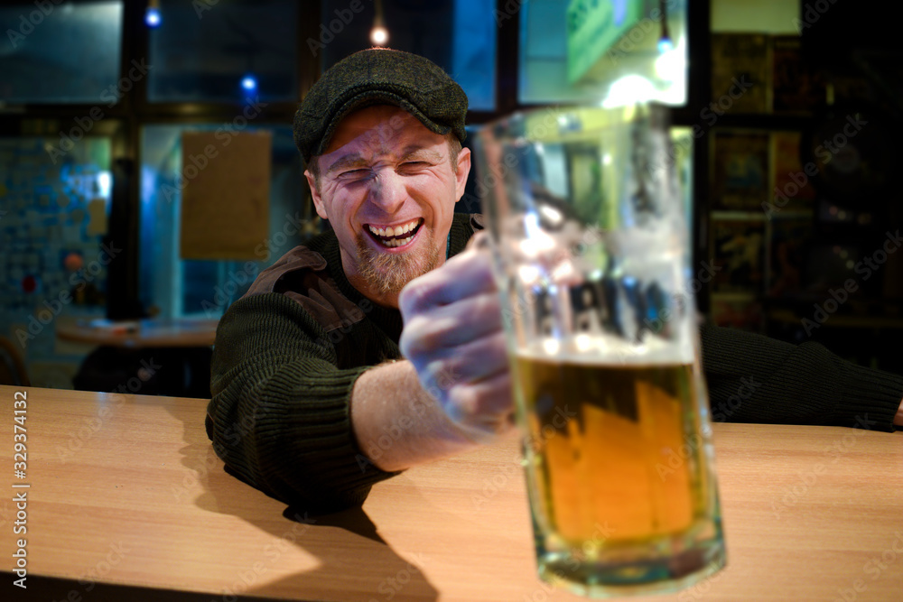 Guy with beer in the bar