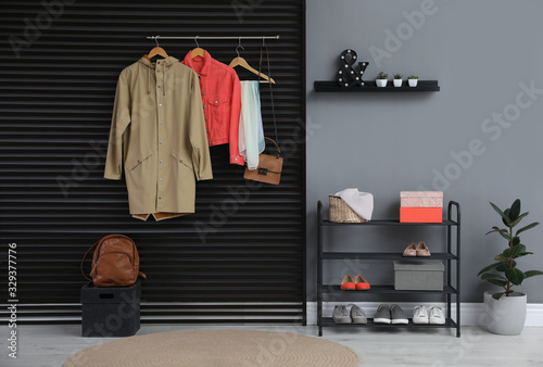 Hallway interior with stylish furniture, clothes and accessories © New Africa