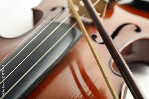 Beautiful classic violin and bow, closeup view. Musical instrument