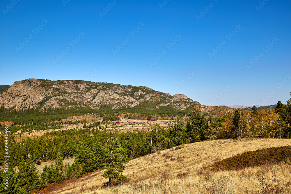 landscape steppe and wooded mountains.
