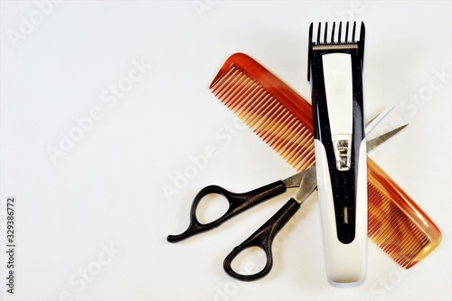 Hairdressing accessories-scissors, comb, machine. The hairdresser provides hair care services - cutting, Curling, creating hairstyles, coloring, highlighting, shaving, cutting beards and mustaches.