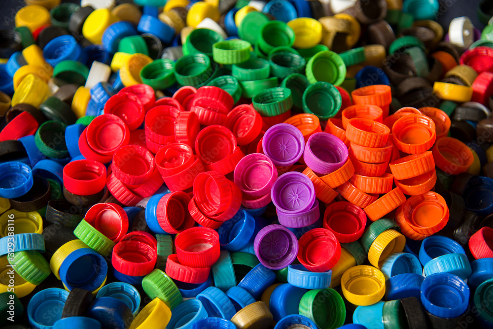 Plastic bottle caps background. Cap material is recyclable.Remove lids