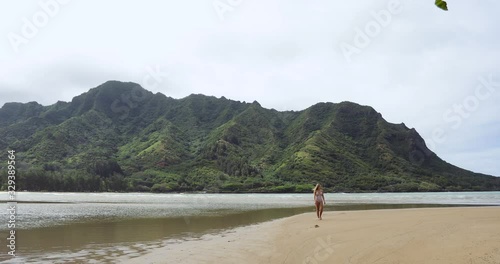 Breathtaking Site of a Woman & a Beautiful Landscape on Oahu, Hawaii photo