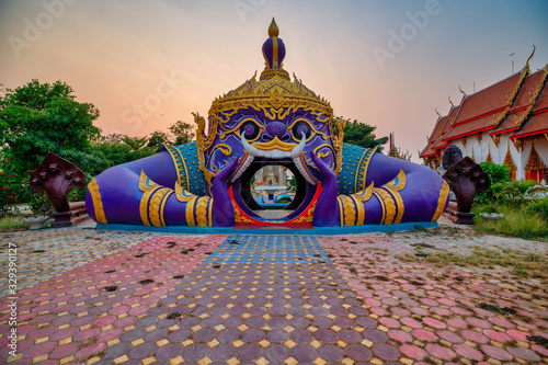 Ban Mi District, Lopburi / Thailand / February 29, 2020  : Wat Khung Tha Lao. There is something interesting that the entrance gate to the temple of Hanuman is open with a distinctive mouth..