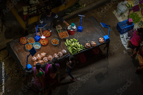 Market stalls selling fruit and vegetables in India photo