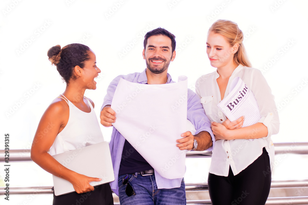 engineers working on a building site.engineers holding a prints for work outdoors.success business engineers working on a building site.engineers holding a prints for work outdoors.success business