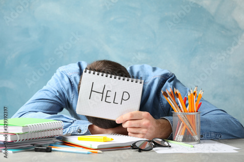 Εκτύπωση καμβά Person hold copybook with inscription Help. Exam preparation