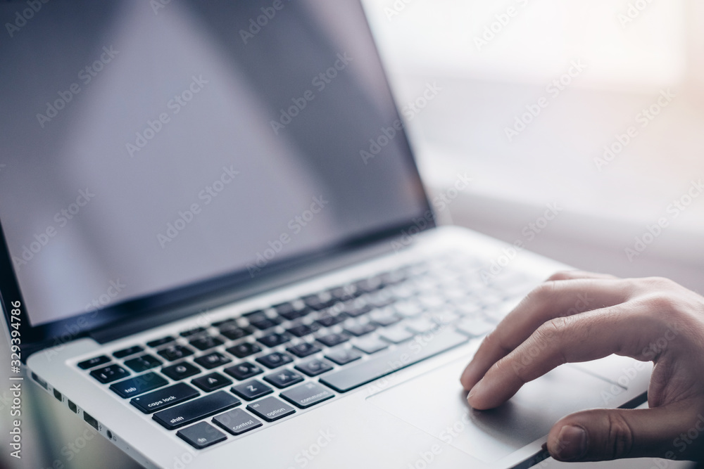 Anonymous man - hand using laptop. security network of connected devices and personal data security.hands typing on laptop Anonymous man - hand using laptop. security network of connected devices and personal data security.hands typing on laptop