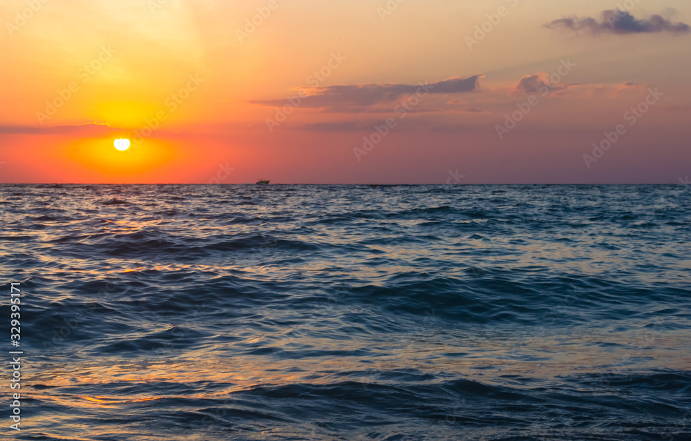 Amazing sea sunset, the sun, waves, clouds