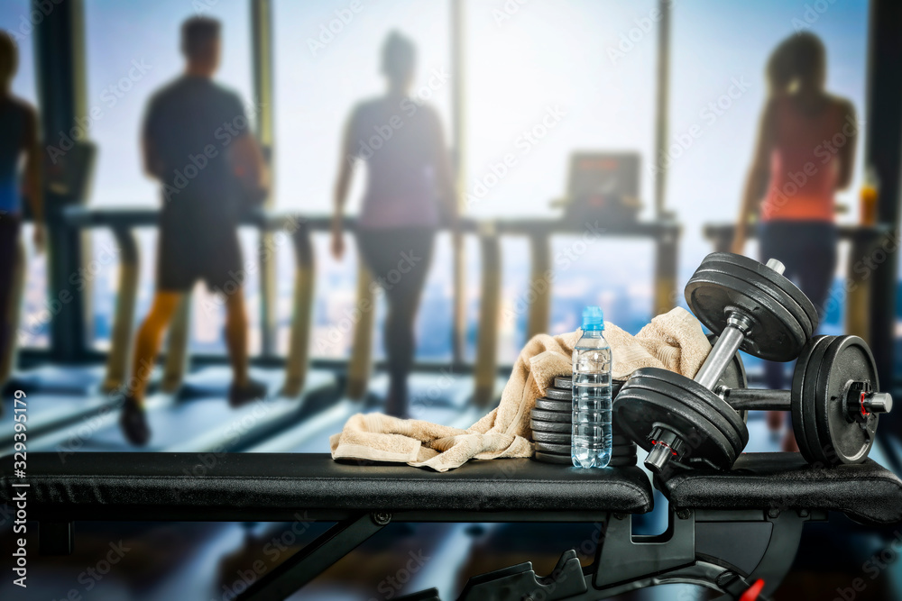 Gym interior and black bench. Dumbbells composition and free space for your decoration. Gym interior and black bench. Dumbbells composition and free space for your decoration.