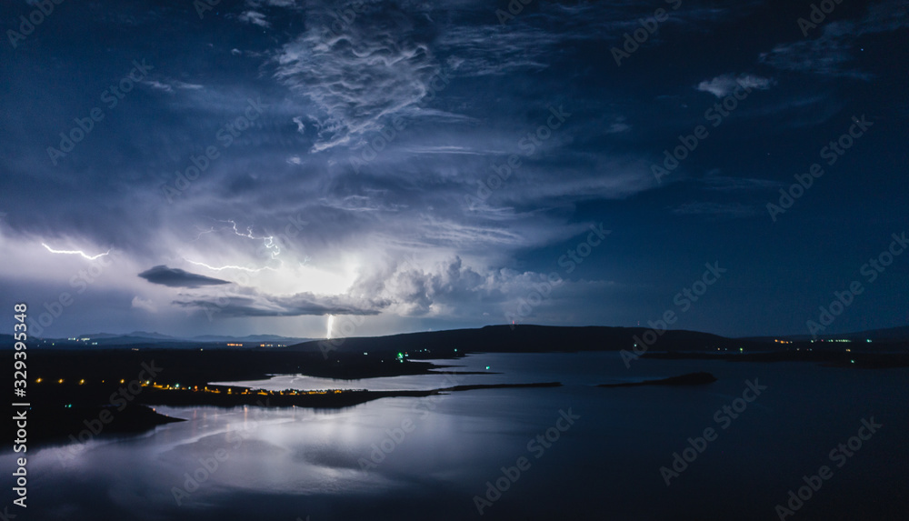Fototapeta premium Lightning over the lake
