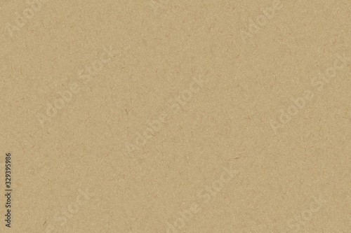 Grainy surface of brown paper texture.