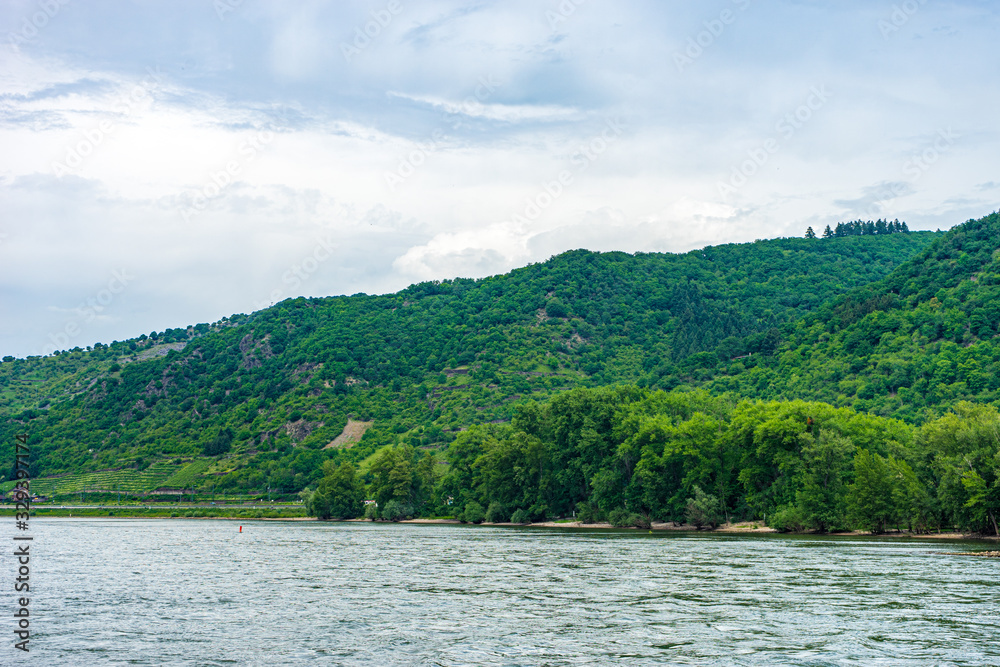 Germany, Rhine Romantic Cruise, a body of water with a mountain in the background