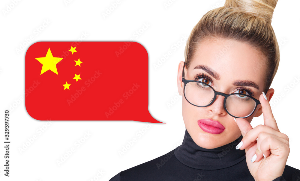 Blonde woman in glasses near dialogue frame with chinese flag. Speak language concept. Blonde woman in glasses near dialogue frame with chinese flag. Speak language concept.