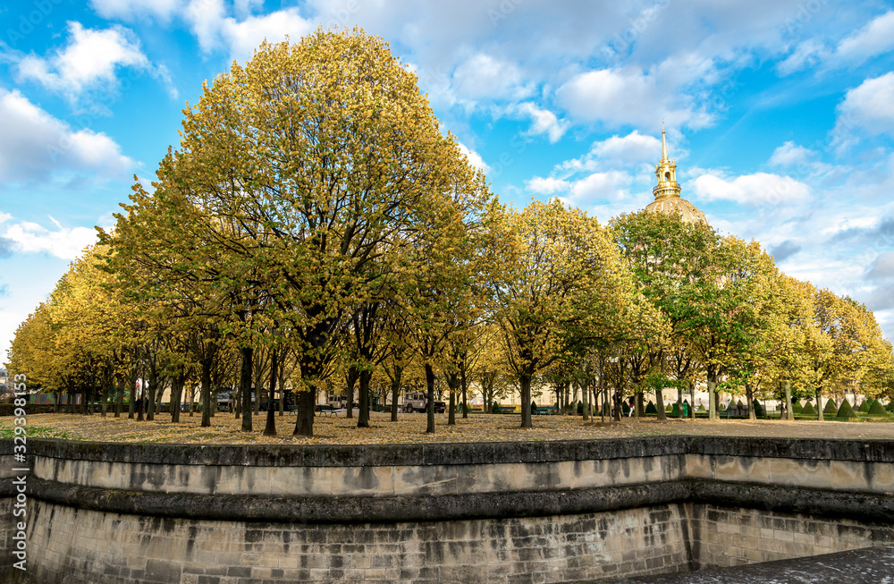 A beautiful park with colorful autumn trees near Les Invalides complex and Cathedral, Paris, France