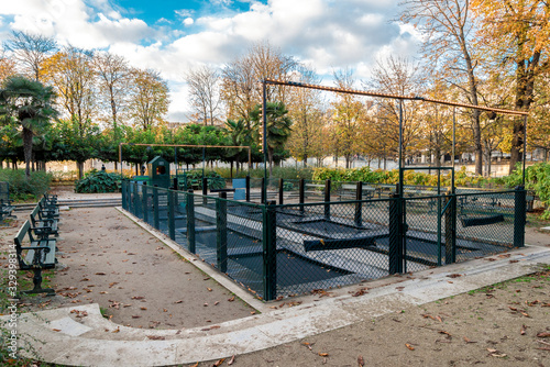 A playground with trampolines for kids in the Tuileries garden, Paris, France