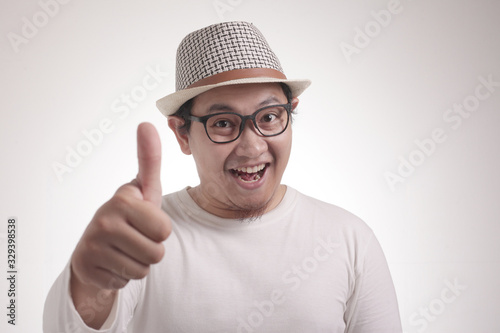 Young Man Showing Thumbs Up Gesture OK Sign