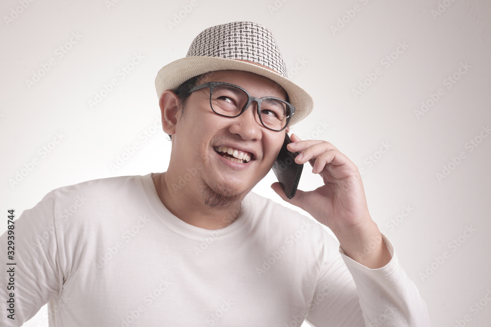 Young Man Talking on his Phone, Happy Smiling Laughing
