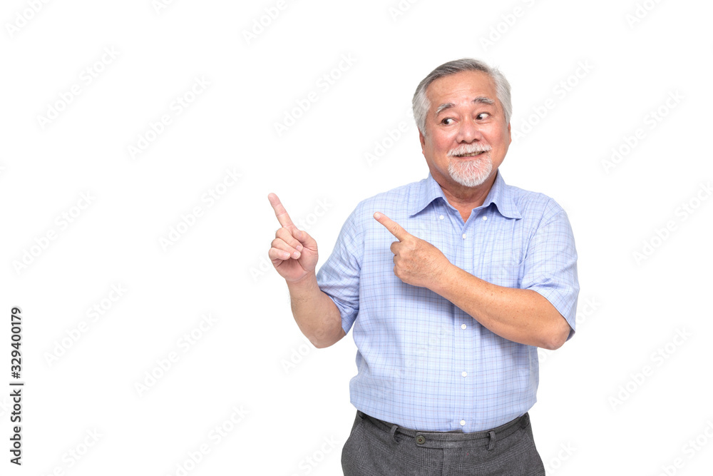 Asian senior man smiling and pointing to empty copy space isolated on white background Asian senior man smiling and pointing to empty copy space isolated on white background