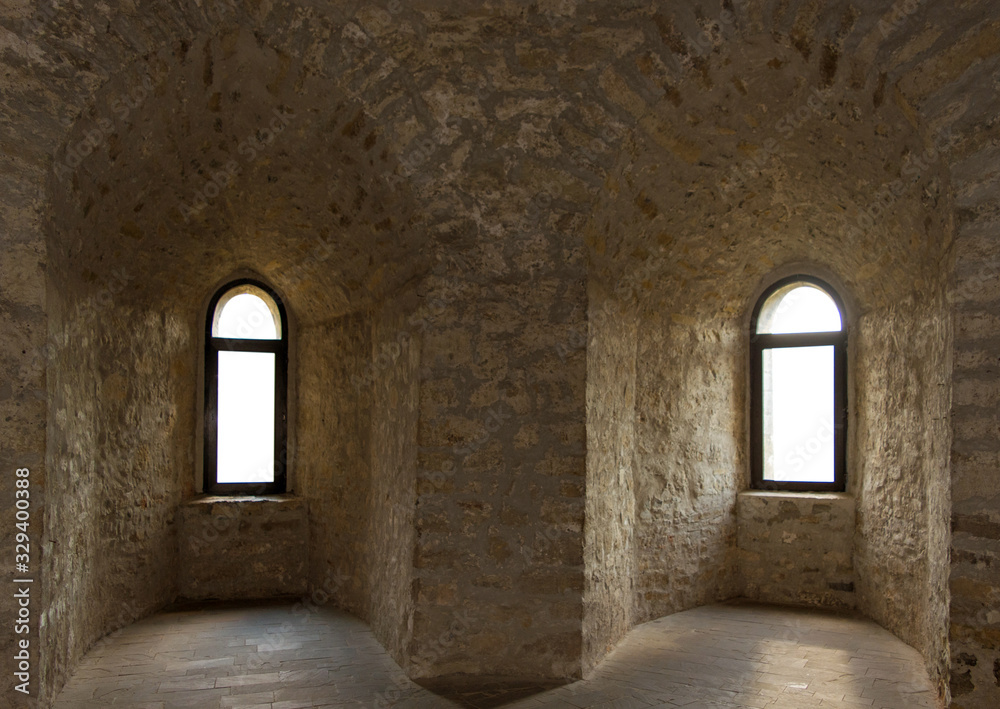 Photo of two old ancient windows in stone castle in Ukraine