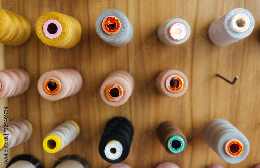 Fototapeta premium Sewing threads as a multicolored background close up