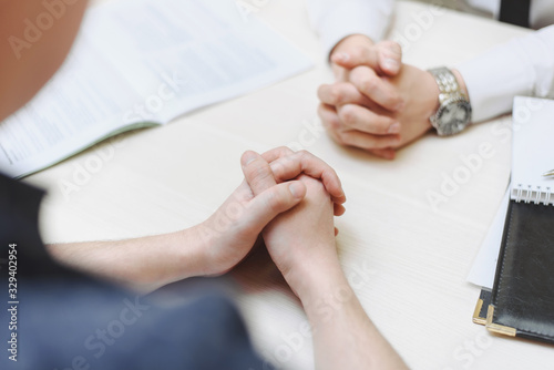 Hand, two men on a desk. Negotiating business. Communication and negotiations between two businessmen
