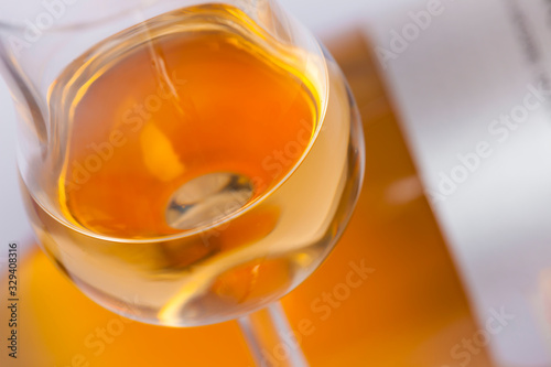 glasses and bottles with orange wine photo
