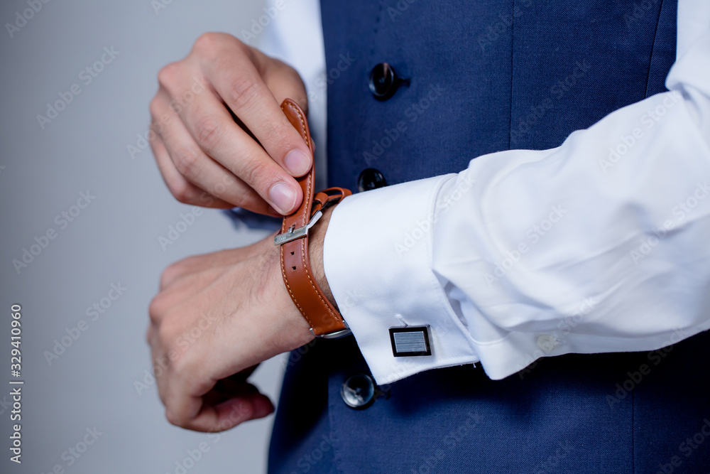 Businessman looking at his watch | Man hands and clock | Groom Wearing Watch Businessman looking at his watch | Man hands and clock | Groom Wearing Watch