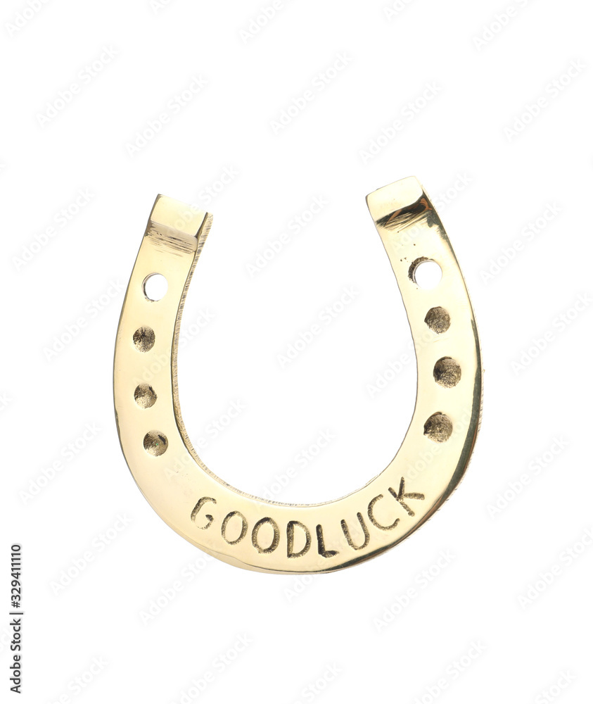 Golden horseshoe with phrase GOOD LUCK isolated on white. St. Patrick's Day celebration Golden horseshoe with phrase GOOD LUCK isolated on white. St. Patrick's Day celebration
