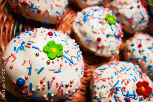 Easter cakes in a wicker basket. Homemade easter baking. Closeup, selective focus