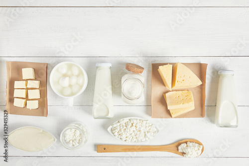 dairy products on a white background. Milk, sour cream, mozzarella, kefir, yogurt, butter, cheese assortment.