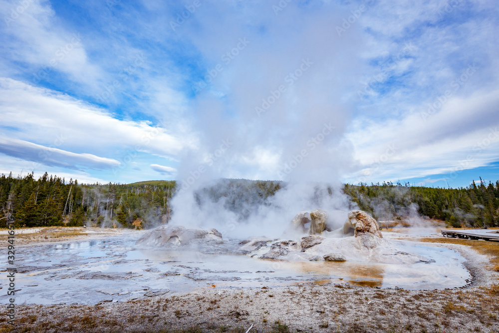 Grotto Geyser with steam bursting into the air, in Yellowstone National Park, Wyoming, USA Grotto Geyser with steam bursting into the air, in Yellowstone National Park, Wyoming, USA