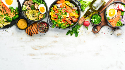 Assortment of food on white wooden background. Seafood, meat and vegetables.