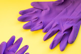 a pair of household rubber gloves isolated on a yellow background.gloves for cleaning . Set of rubber gloves. Composition of protective gloves for cleaning. Variety of protective clothing.