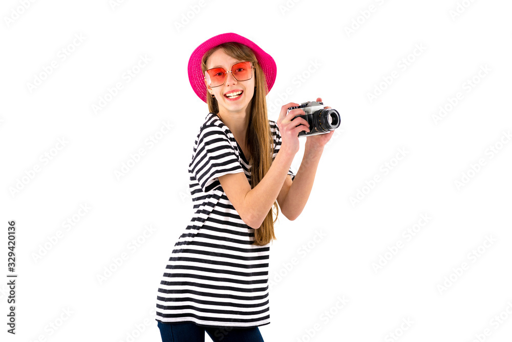 Portrait of smiling girl in striped summer casual clothes,red hat with photo camera isolated on white background. Female passenger traveling abroad to travel on weekends getaway.Journey concept. Portrait of smiling girl in striped summer casual clothes,red hat with photo camera isolated on white background. Female passenger traveling abroad to travel on weekends getaway.Journey concept.