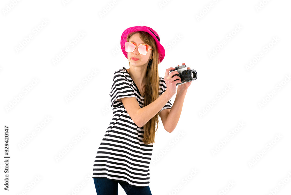 Portrait of smiling girl in striped summer casual clothes,red hat with photo camera isolated on white background. Female passenger traveling abroad to travel on weekends getaway.Journey concept. Portrait of smiling girl in striped summer casual clothes,red hat with photo camera isolated on white background. Female passenger traveling abroad to travel on weekends getaway.Journey concept.