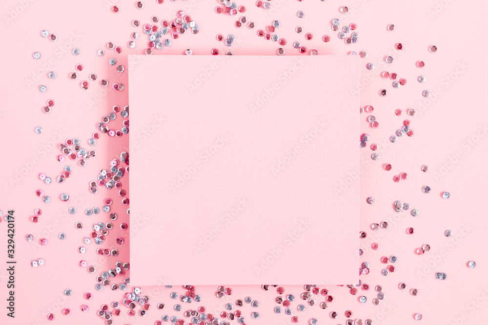 Festive pink background. Empty paper blank. Shining confetti on light pink pastel background. Christmas. Wedding. Birthday. Happy woman's day. Mothers Day. Valentine's Day. Flat lay, top view, copy 