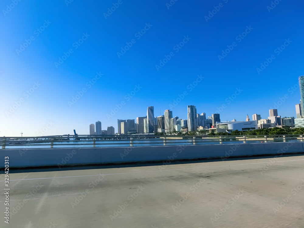 Miami skyscrapers with bridge over sea in the day. Miami skyscrapers with bridge over sea in the day.