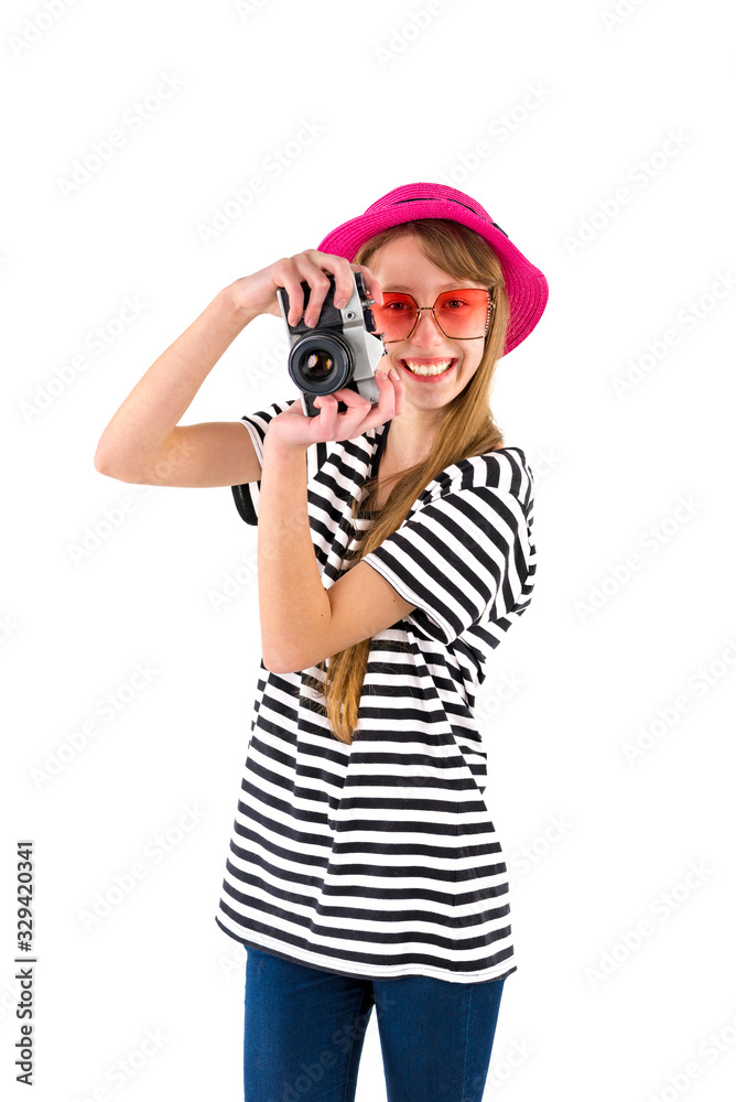 Portrait of smiling girl in striped summer casual clothes,red hat with photo camera isolated on white background. Female passenger traveling abroad to travel on weekends getaway.Journey concept. Portrait of smiling girl in striped summer casual clothes,red hat with photo camera isolated on white background. Female passenger traveling abroad to travel on weekends getaway.Journey concept.