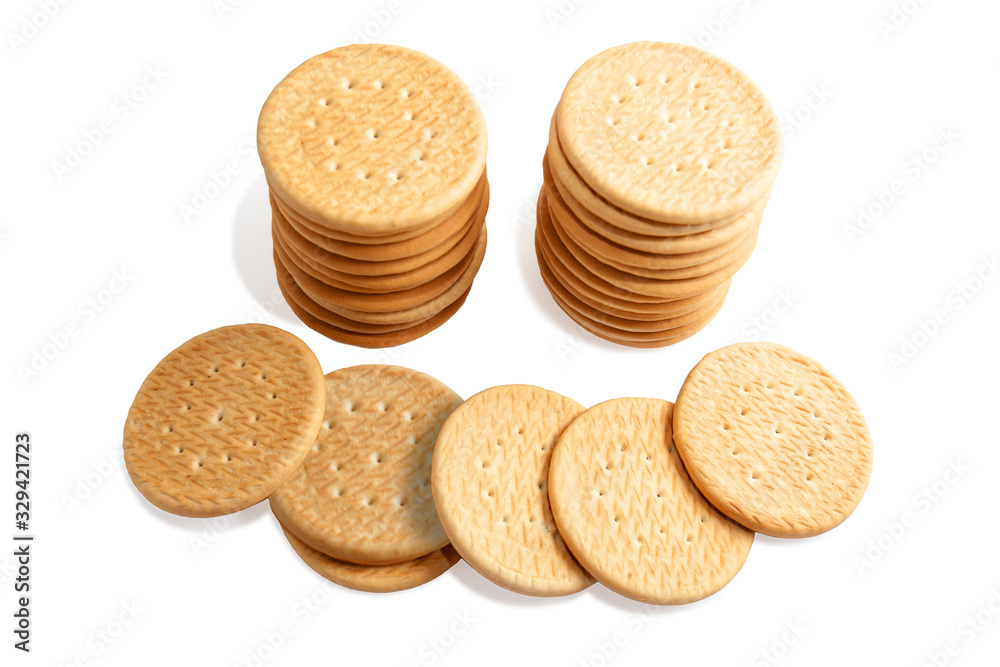 Wheat round cookies on a white background. Biscuits on the table. Morning breakfast cracker snack. Wheat light meal snack in lunch time. Wheat round cookies on a white background. Biscuits on the table. Morning breakfast cracker snack. Wheat light meal snack in lunch time.