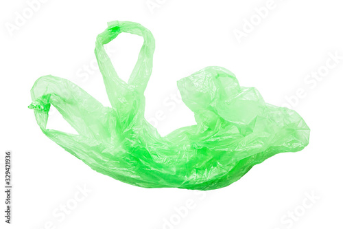 Green plastic bag with handles on a white background isolate.