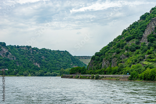 Germany  Rhine Romantic Cruise  a body of water with a mountain in the background