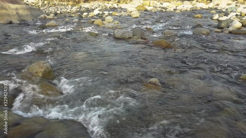 4K footage of Morning scenery river flow over the river on nature rural village. photo