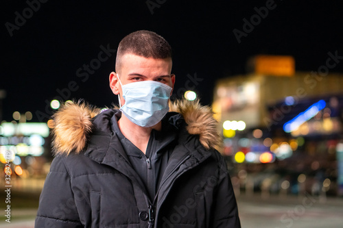 Man wearing medical face mask for coronavirus protection.