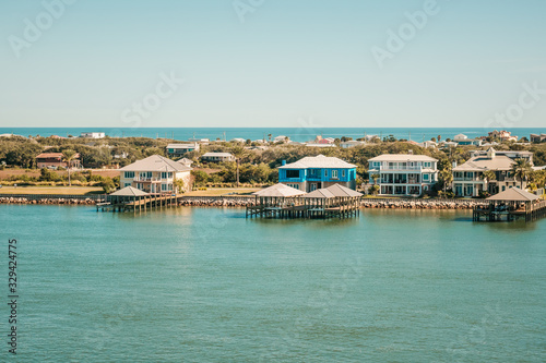 Condo Buildings and New Construction Along Coastal Inlet with Ocean in Distance