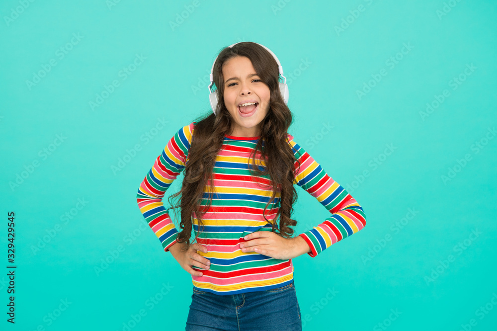 In her own style. on positive tune. her special playlist. small girl listen music in headset. audio book for kids. teen child express positivity. schoolgirl in colorful cloth. favorite driving track