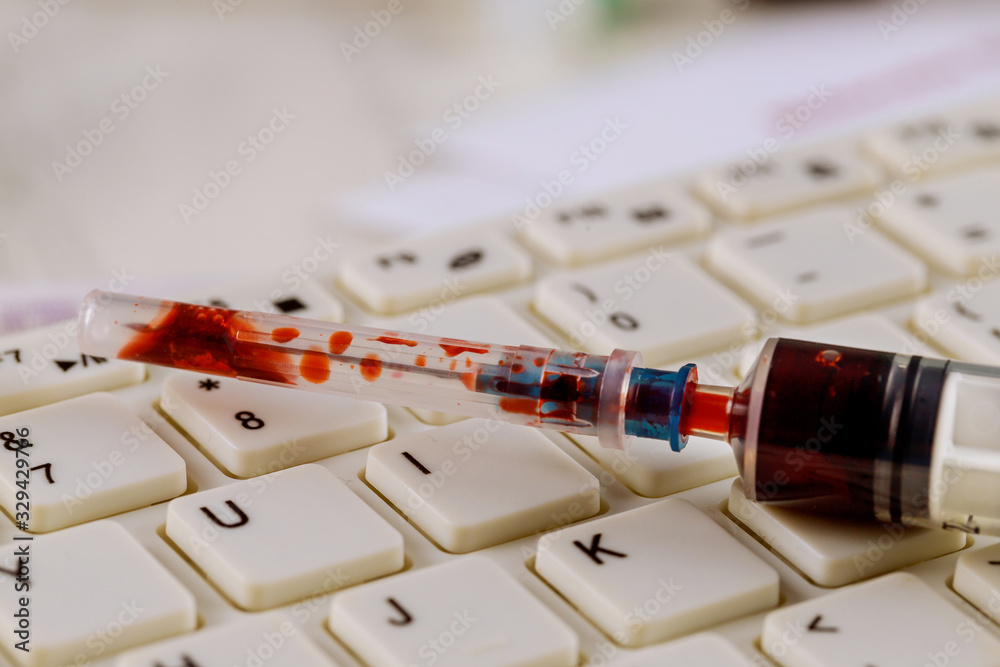 Corona virus inscription with syringe and blood inside Covid 19 outbreak Corona virus inscription with syringe and blood inside Covid 19 outbreak