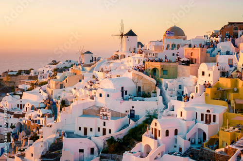 Fototapeta Santorini Oia village during sunset whit luxury hotels and whitewashed buildings in Santorini Island a luxury vacation destination in Greece