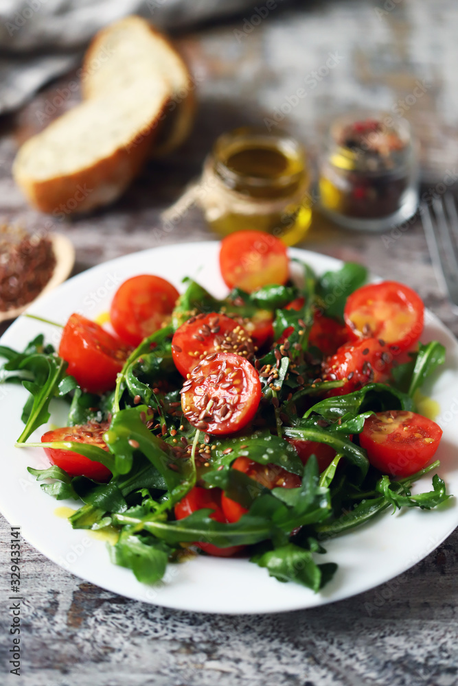 Healthy salad with arugula, cherry tomatoes and seeds. Diet concept. Healthy salad with arugula, cherry tomatoes and seeds. Diet concept.