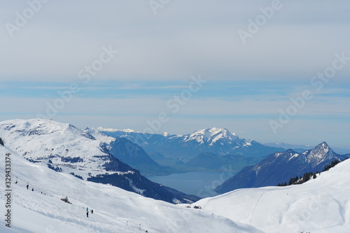 Skiing slopes of Hoch Ybrig skiing resort Switzerland with view on Lake Lucerne
